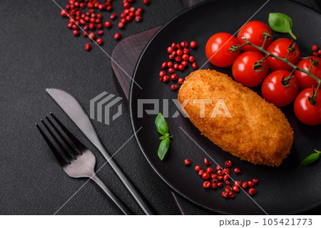 Delicious baked potato cutlet stuffed with chicken and vegetables, spices and salt 105421773