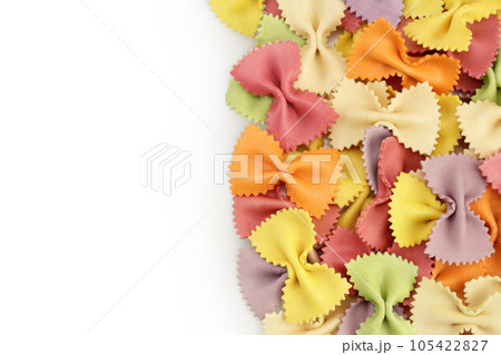 colorful farfalle pasta isolated on white background . Top view with copy space for your text. Flat lay. colorful farfalle pasta isolated on white background . Top view with copy space for your text. Flat lay. 105422827