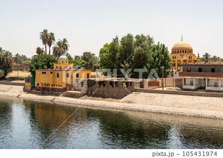 Panoramic view of fertile banks of Nile and everyday life during river cruise River near Luxor Egypt direction assuan Panoramic view of fertile banks of Nile and everyday life during river cruise River near Luxor Egypt direction assuan 105431974