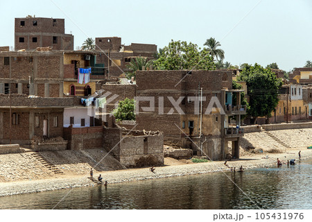 Panoramic view of fertile banks of Nile and everyday life during river cruise River near Luxor Egypt direction assuan Panoramic view of fertile banks of Nile and everyday life during river cruise River near Luxor Egypt direction assuan 105431976