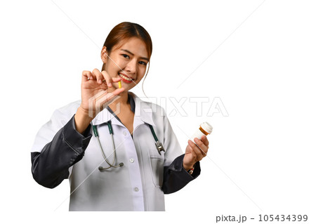 Smiling female health worker holding bottles of pills with a blank white label isolated on white background 105434399