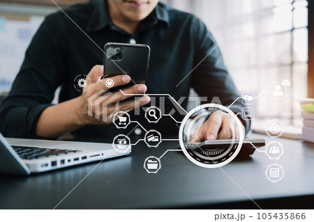 Businessman working on desk office with using a calculator to calculate the numbers, finance concept in office. Businessman working on desk office with using a calculator to calculate the numbers, finance concept in office. 105435866