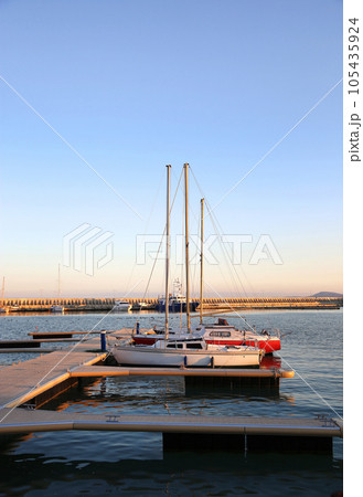 Beautiful view of the evening port on the black sea Beautiful view of the evening port on the black sea 105435924