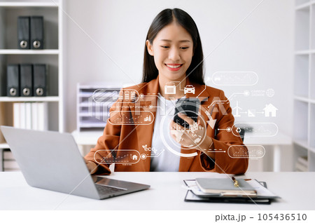 Business woman working with reduce CO2 concept with icons, global warming such as reforest green factory recycle and zero carbon dioxide emission concept. with VR icon at office. Business woman working with reduce CO2 concept with icons, global warming such as reforest green factory recycle and zero carbon dioxide emission concept. with VR icon at office. 105436510