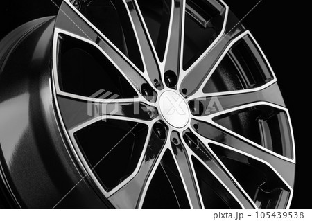 Beautiful shiny black cast disc from a close-up car Beautiful shiny black cast disc from a close-up car 105439538