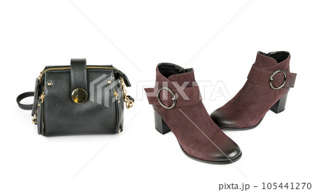 Elegant female ankle boots and a small handbag isolated on a white . Collage. Wide photo. Elegant female ankle boots and a small handbag isolated on a white . Collage. Wide photo. 105441270