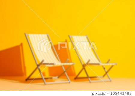 Blurred background with empty deck chairs on yellow background. Sunbed, studio shot. Beach tourism, travel, relax, vacai, holiday, minimal summer vacation concept. AI generated 105443495
