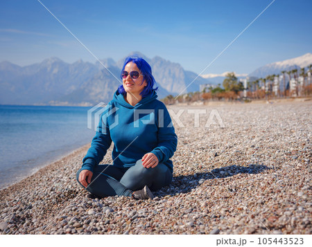 Female wearing light blue oversize hoodie and jeans 105443523