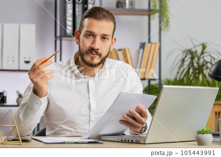 Business man reading business contract, planning project, analyzing resume, good paperwork results Business man reading business contract, planning project, analyzing resume, good paperwork results 105443991