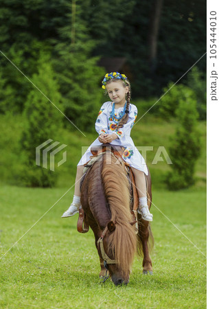girl riding a pony girl riding a pony 105444010