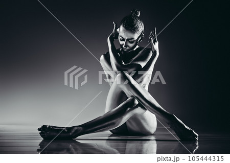 Young woman sitting 105444315