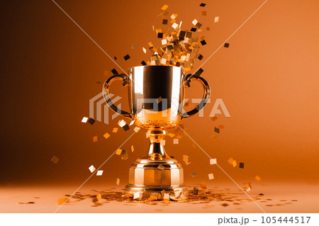 Gold winner cup with confetti. Golden champion cup, trophy for the winner, award, victory, first place of competition, winning and success concept. Copy space. Ai generated 105444517