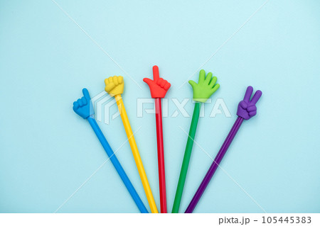 Colorful school erasers in the form of various gestures on colored pencils on a blue background. The concept of nonverbal communication, the expression and transmission of thoughts using symbols Colorful school erasers in the form of various gestures on colored pencils on a blue background. The concept of nonverbal communication, the expression and transmission of thoughts using symbols 105445383