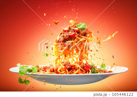 Spaghetti with tomato sauce in a bowl. Levitation. 105446122