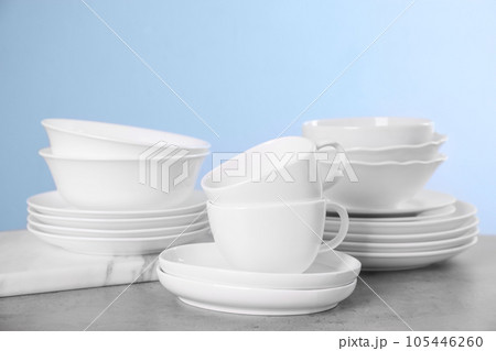 Set of clean tableware on grey table Set of clean tableware on grey table 105446260