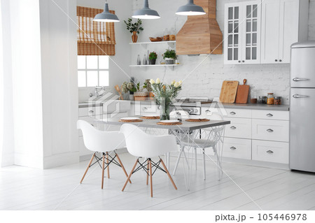Beautiful kitchen interior with new stylish furniture Beautiful kitchen interior with new stylish furniture 105446978