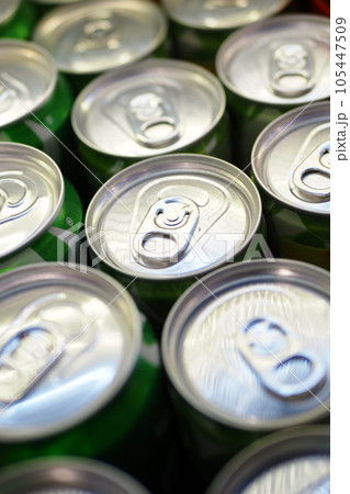 Cans of soft drink lined up , 105447509