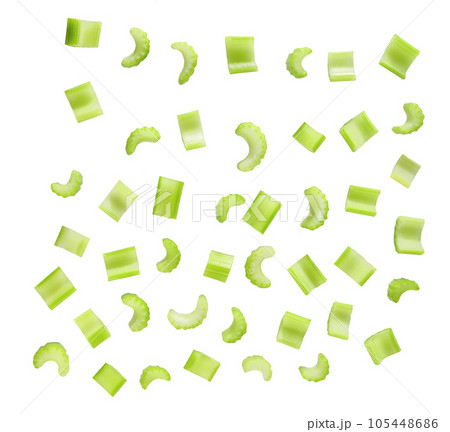 Falling celery slices isolated on white background, clipping path. Falling celery slices isolated on white background, clipping path. 105448686