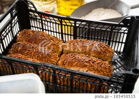 Freshly baked bread in crate in bakery 105450515