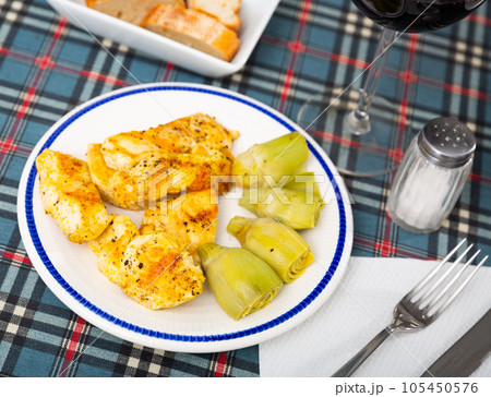 Grilled chicken fillet with artichokes Grilled chicken fillet with artichokes 105450576