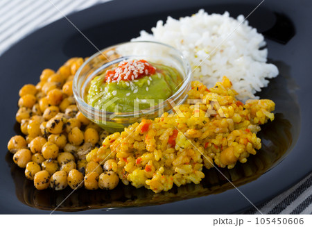 Healthy food of garbanzos and rice with red and green sauces 105450606
