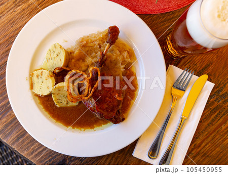 Confit du canard in czech with sauerkraut and potato dumplings Confit du canard in czech with sauerkraut and potato dumplings 105450955
