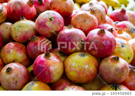 Fresh pomegranates in cardboard boxes 105450983