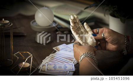 Concept of psychic advisor or ways of divination with cards. Concept of psychic advisor or ways of divination with cards. 105451096