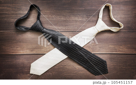 two ties, white and black, crossed like swords. Struggle concept 105451157