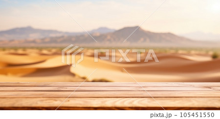The empty wooden brown table top with blur background of desert dune mountain. Exuberant. 105451550