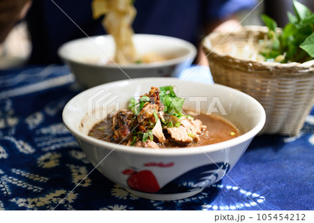 Rice noodles soup with pork and vegetables, Thai boat noodles style Rice noodles soup with pork and vegetables, Thai boat noodles style 105454212