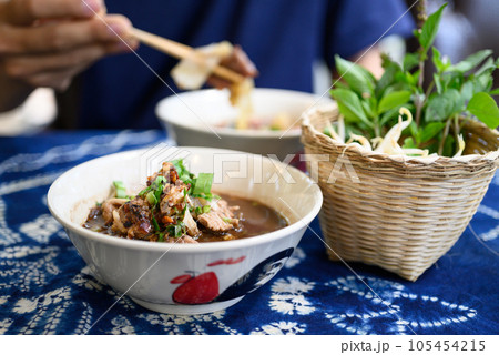 Rice noodles soup with pork and vegetables, Thai boat noodles style Rice noodles soup with pork and vegetables, Thai boat noodles style 105454215
