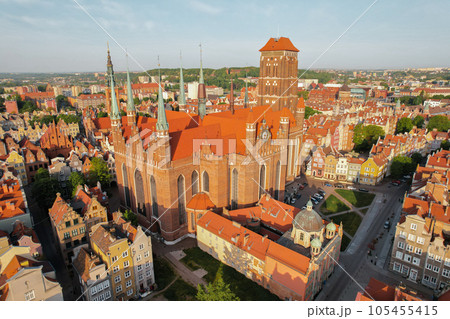 St. Mary's Basilica Beautiful panoramic architecture of old town in Gdansk, Poland at sunrise. Aerial view drone pov. Landscape cityscape City from Above. Small vintage historical buildings Europe 105455415