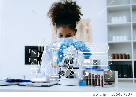 African Dctor work on digital tablet healthcare doctor technology tablet using computer  in laboratory study with virtual icon. 105457537