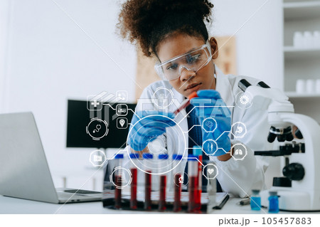 Coronavirus COVID 19 medical test vaccine research and development concept. Scientist in laboratory study and analyze scientific sample of Coronavirus antibody with Vr icon 105457883