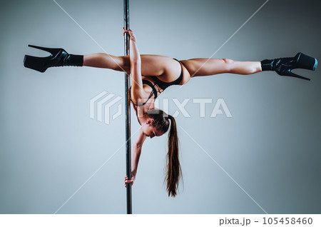 Woman pole dancing 105458460