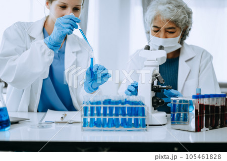 Scientist team meeting and writing analysis results in the laboratory study and analyze scientific sample for global warming, analytics and tech.. 105461828