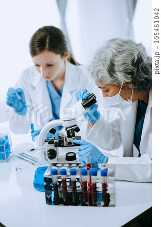 Scientist team meeting and writing analysis results in the laboratory study and analyze scientific sample for global warming, analytics and tech.. Scientist team meeting and writing analysis results in the laboratory study and analyze scientific sample for global warming, analytics and tech.. 105461942