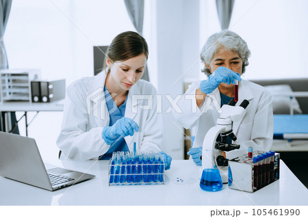 Scientist team meeting and writing analysis results in the laboratory study and analyze scientific sample for global warming, analytics and tech.. 105461990