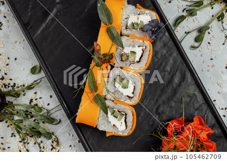 Rainbow Sushi Roll with salmon, eel, tuna, avocado, royal prawn, cream cheese Philadelphia, caviar tobica, chuka. Sushi menu. Japanese food. Rainbow Sushi Roll with salmon, eel, tuna, avocado, royal prawn, cream cheese Philadelphia, caviar tobica, chuka. Sushi menu. Japanese food. 105462709