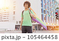 Smiling handsome young man with LGBT flag in his hands 105464458