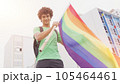 Smiling handsome young man with LGBT flag in his hands 105464461