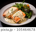 salmon in white sauce with a salad of aromatic herbs and cherry tomatoes. 105464678