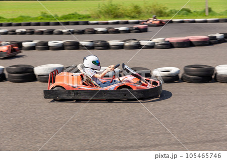 Youth Go Kart Racer on track. 105465746