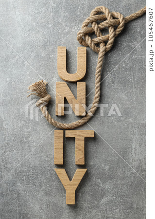 The word "unity" in wooden letters with a rope The word "unity" in wooden letters with a rope 105467607