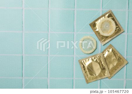 Condoms on a blue background, place for text 105467720