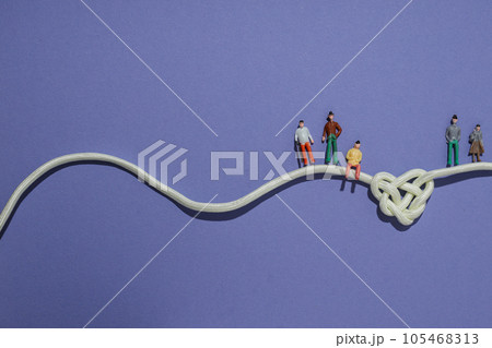 Celtic knot in the shape of a heart made of white cord. Concept of creative unity, faith and protection. Place for text 105468313