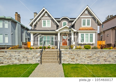 Luxury residential houses with landscaped front yard on land terrace 105468817