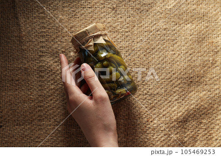 Tasty canned food concept, canned cucumbers, food for winter Tasty canned food concept, canned cucumbers, food for winter 105469253