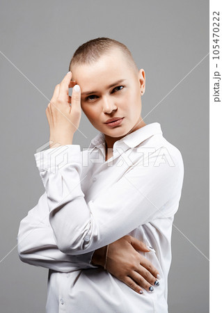 pretty young woman with short haircut 105470222